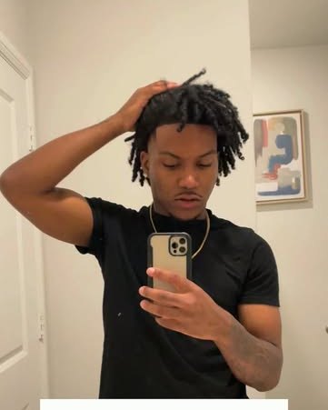 Jaden Campbell, the barber, in a mirror selfie captioned The artist vs.